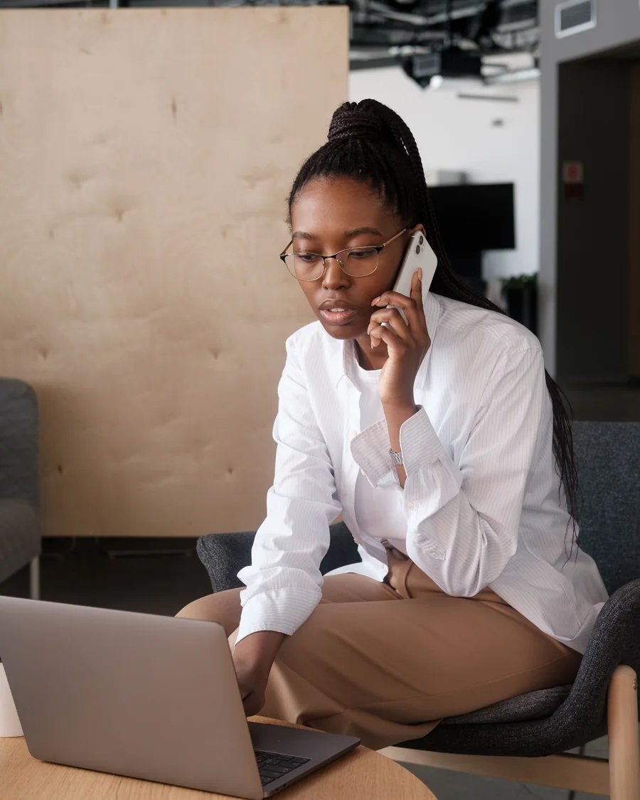 A client working with Mr. Taxes Pro remotely by phone and laptop